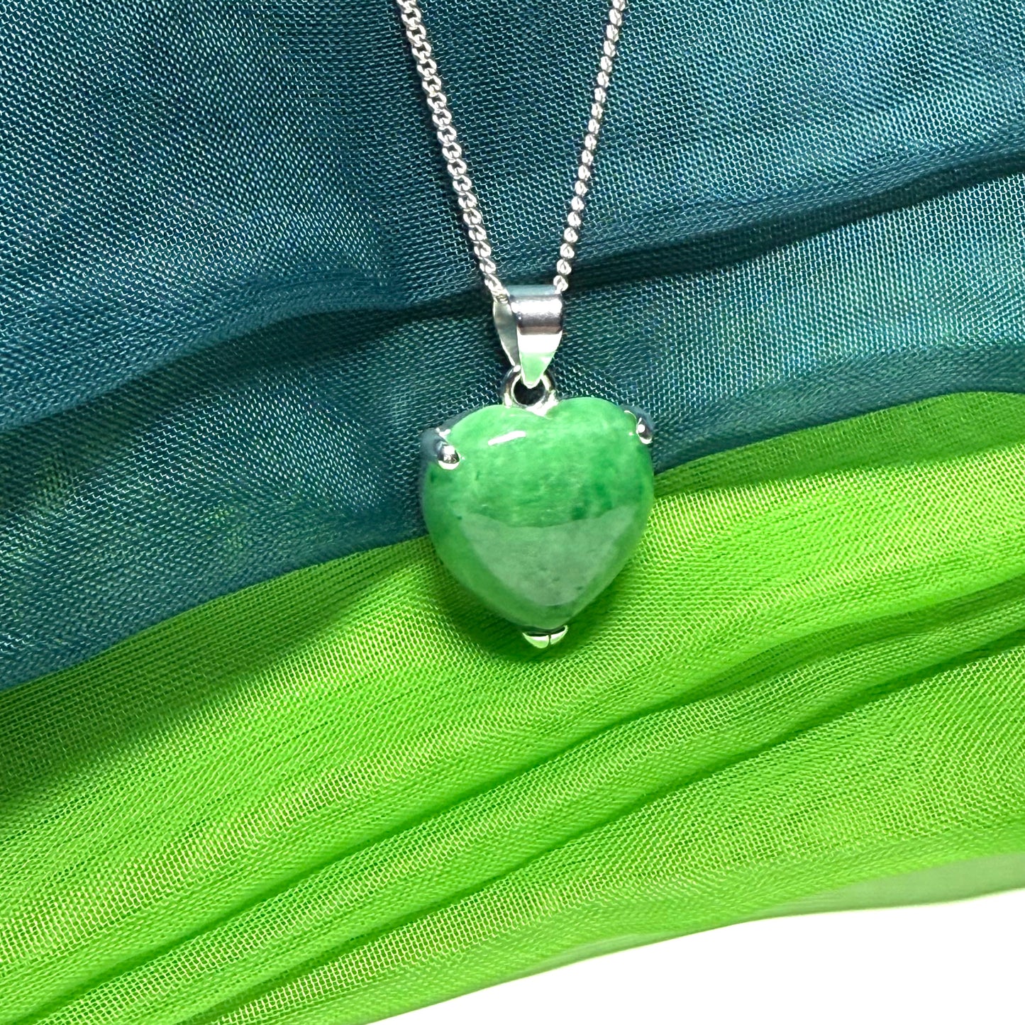 A real dark green jade pendant necklace heart shape sterling silver and a chain