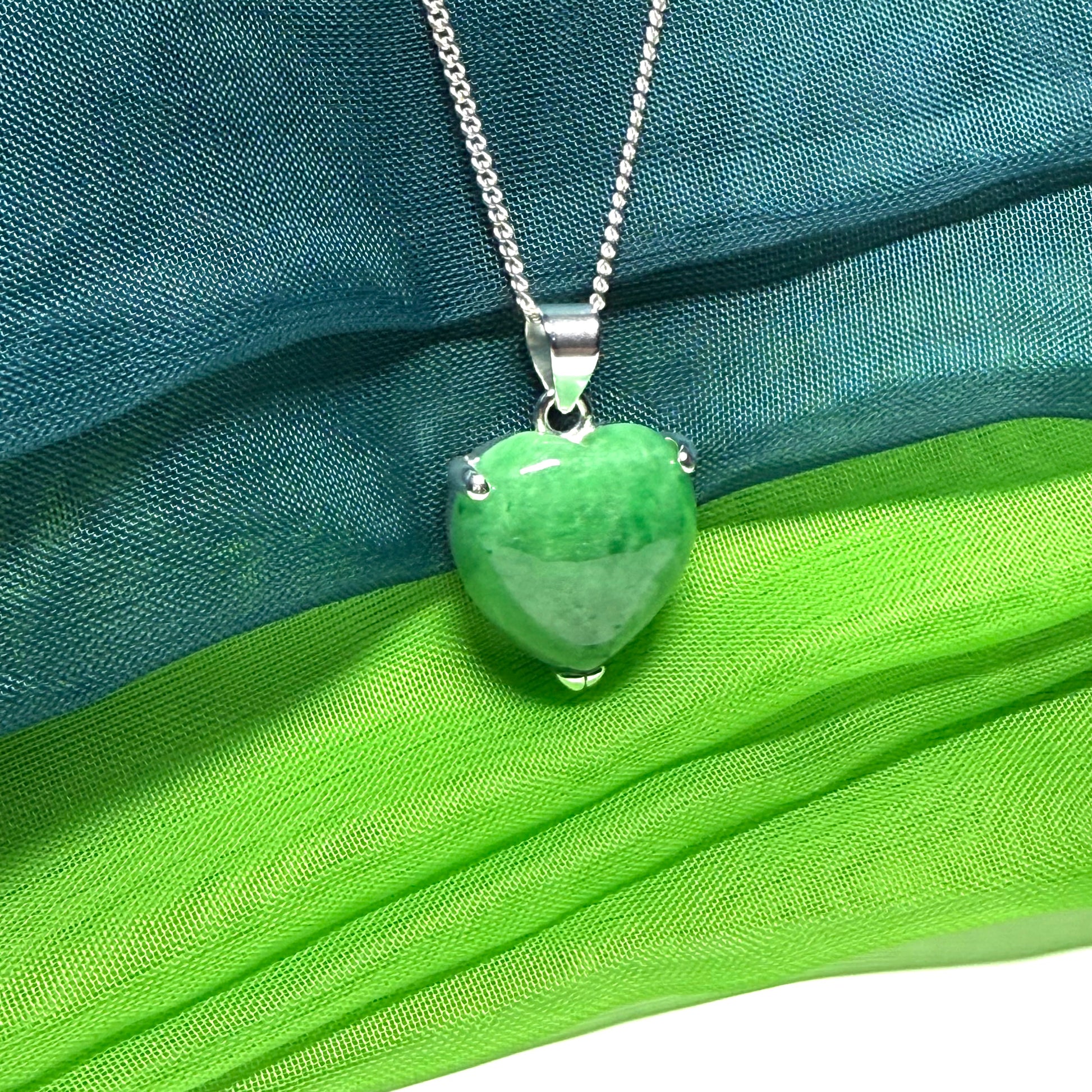 A real dark green jade pendant necklace heart shape sterling silver and a chain