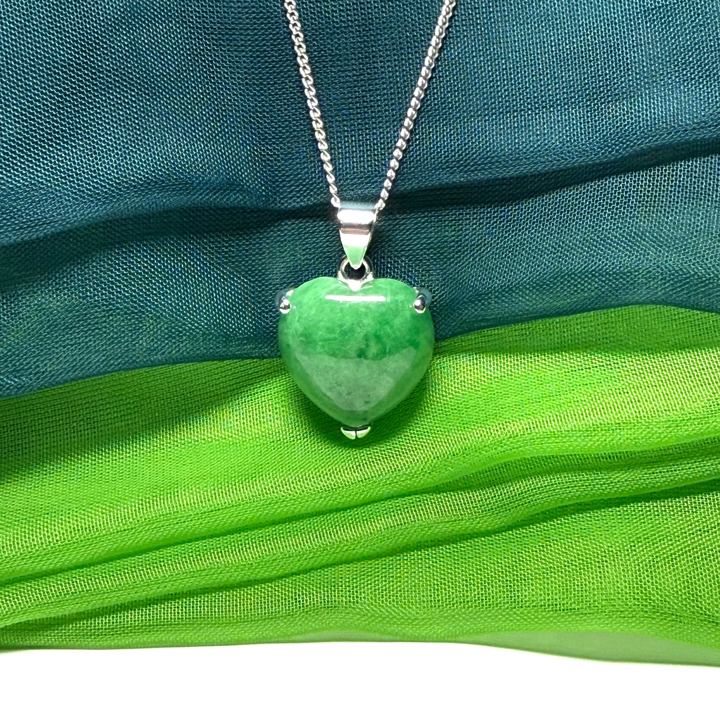 A real dark green jade pendant necklace heart shape sterling silver and a chain