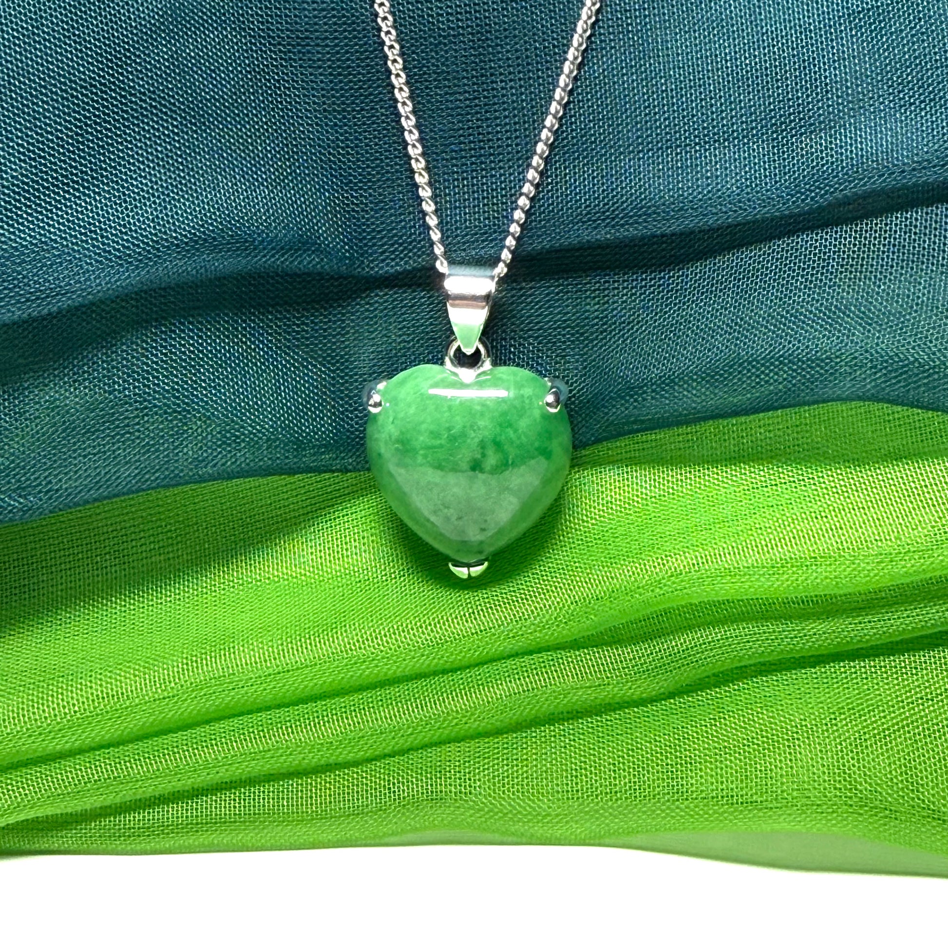 A real dark green jade pendant necklace heart shape sterling silver and a chain