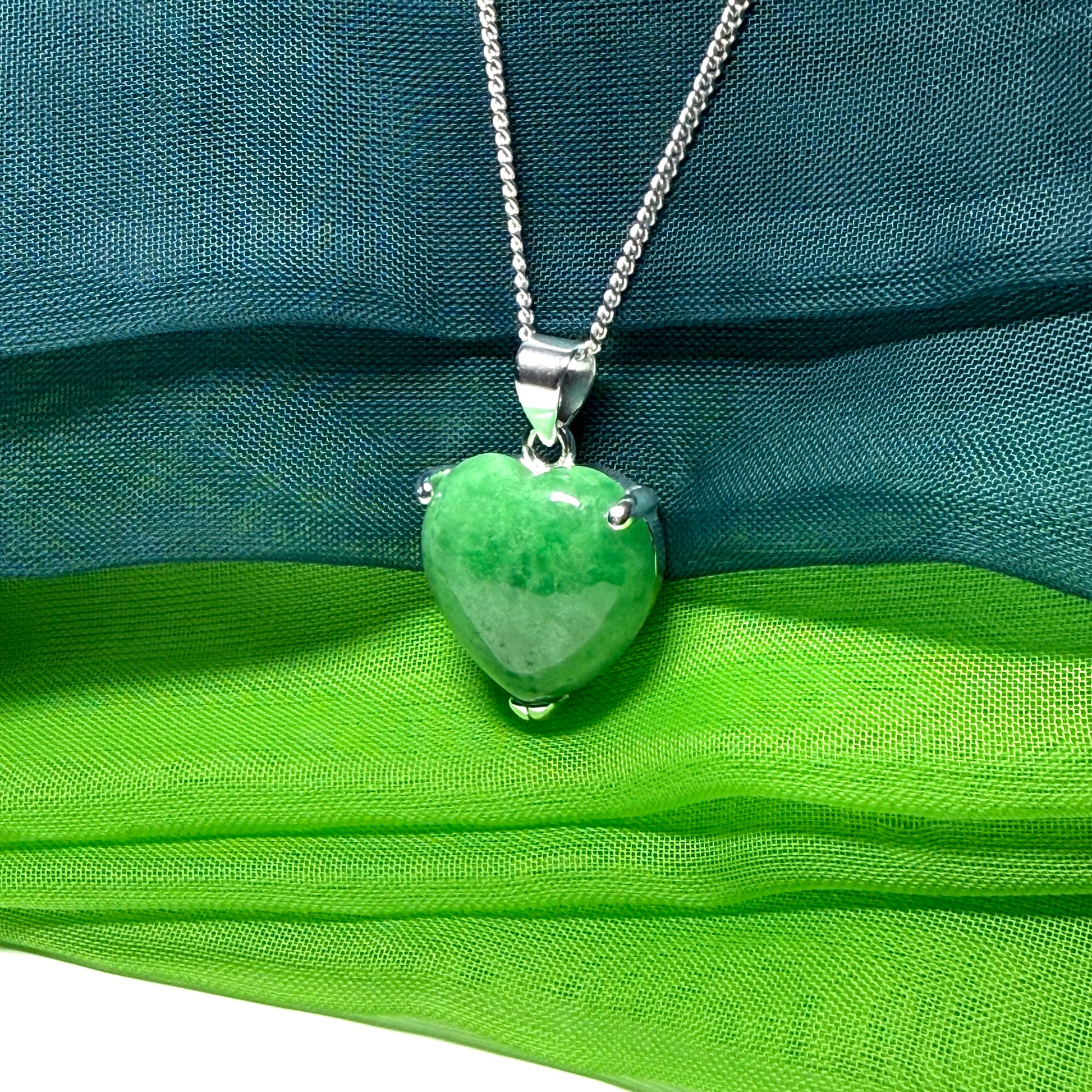 A real dark green jade pendant necklace heart shape sterling silver and a chain