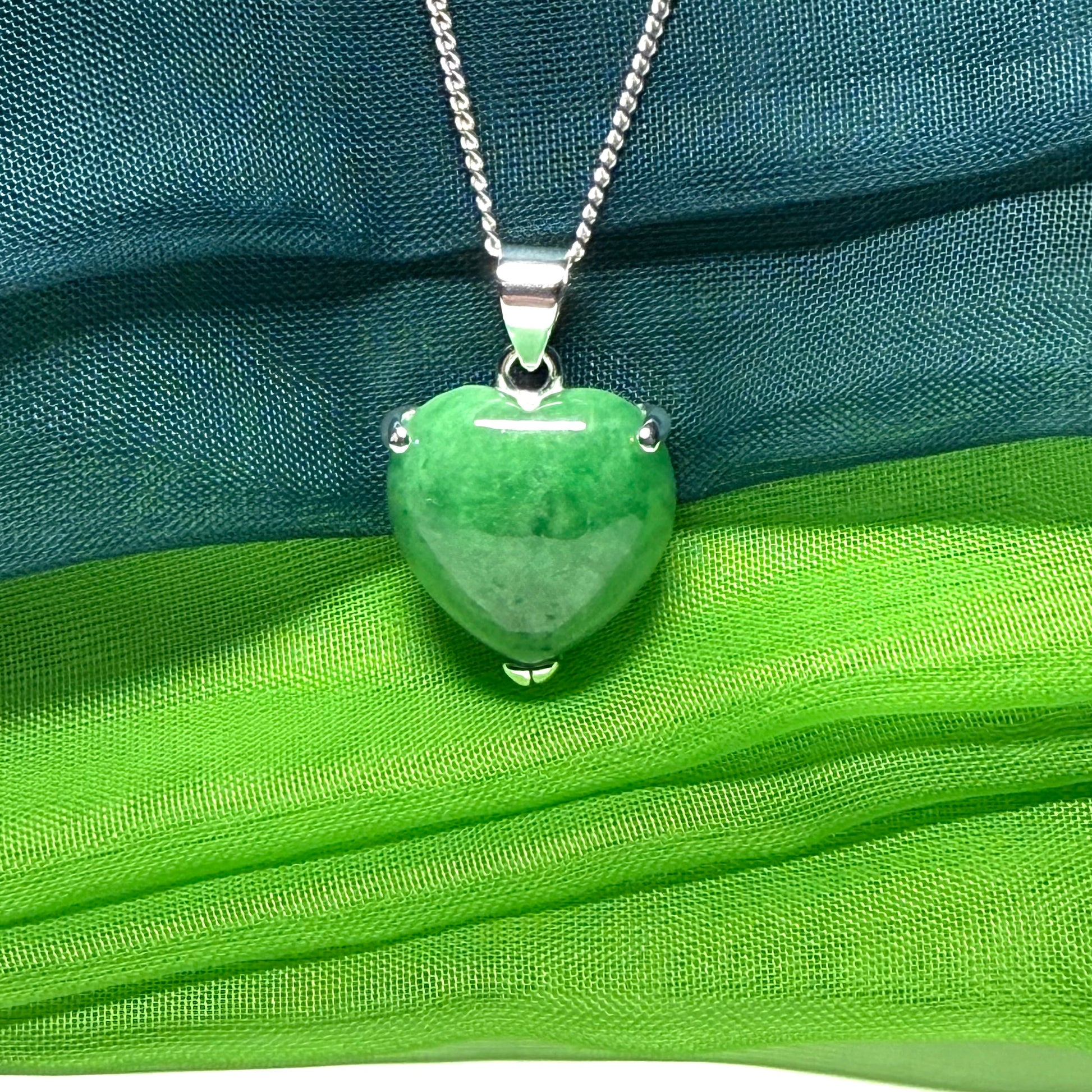 A real dark green jade pendant necklace heart shape sterling silver and a chain