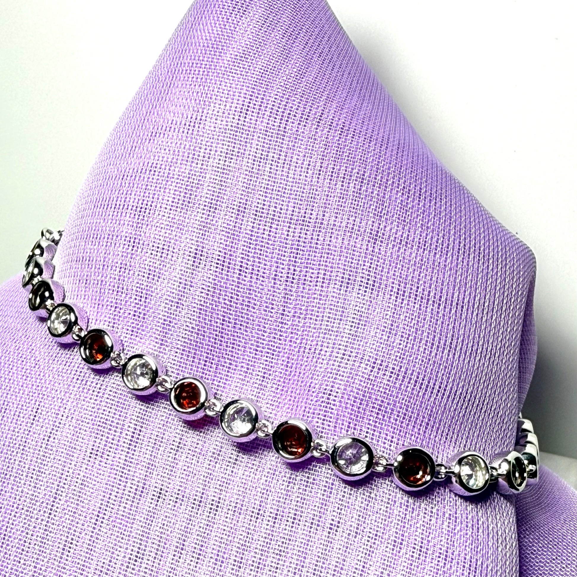 Real garnet and cubic zirconia round sterling silver bracelet