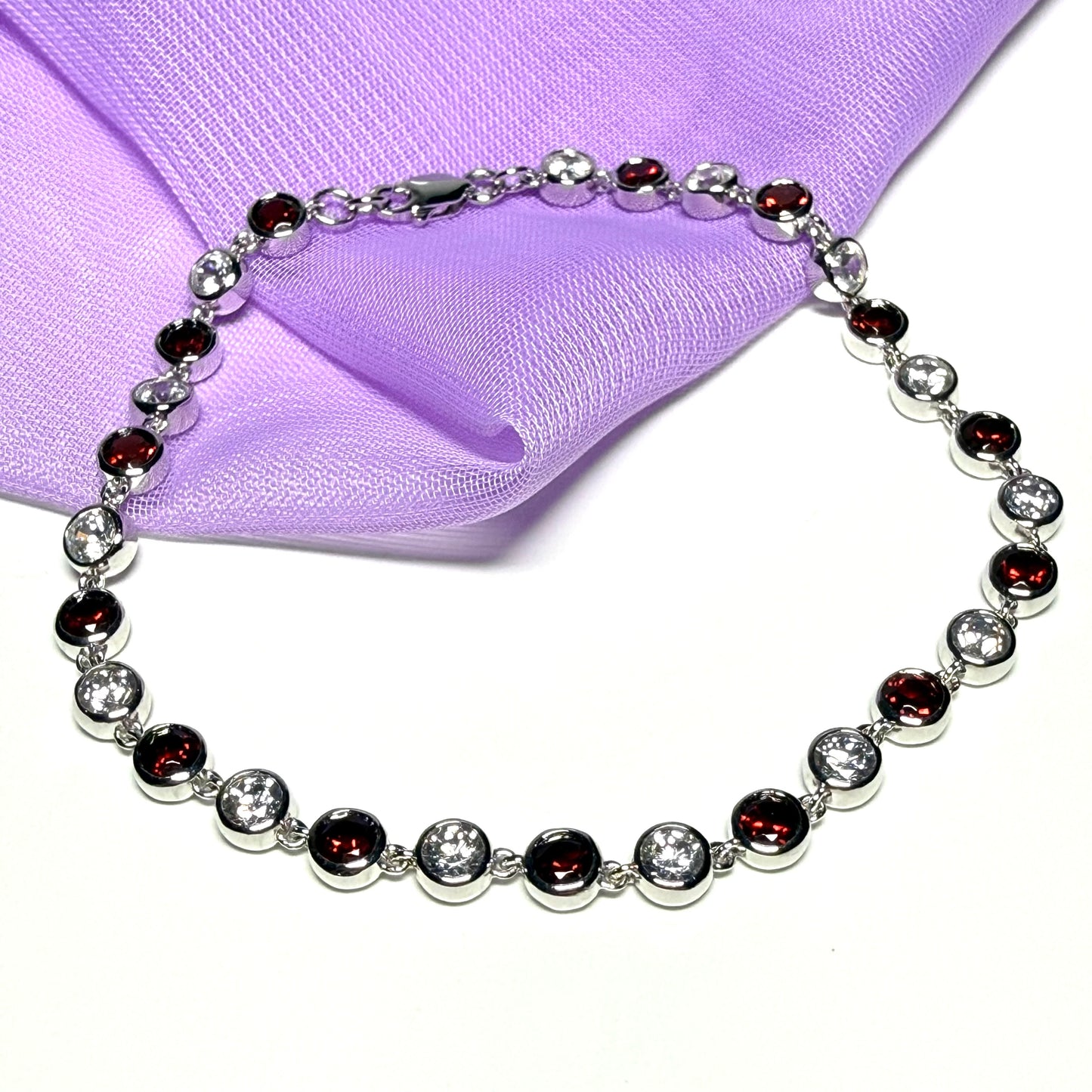Real garnet and cubic zirconia round sterling silver bracelet