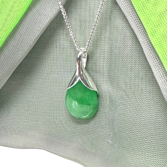 A real green jade necklace having a tear drop or pear shape, an outstanding designed pendant