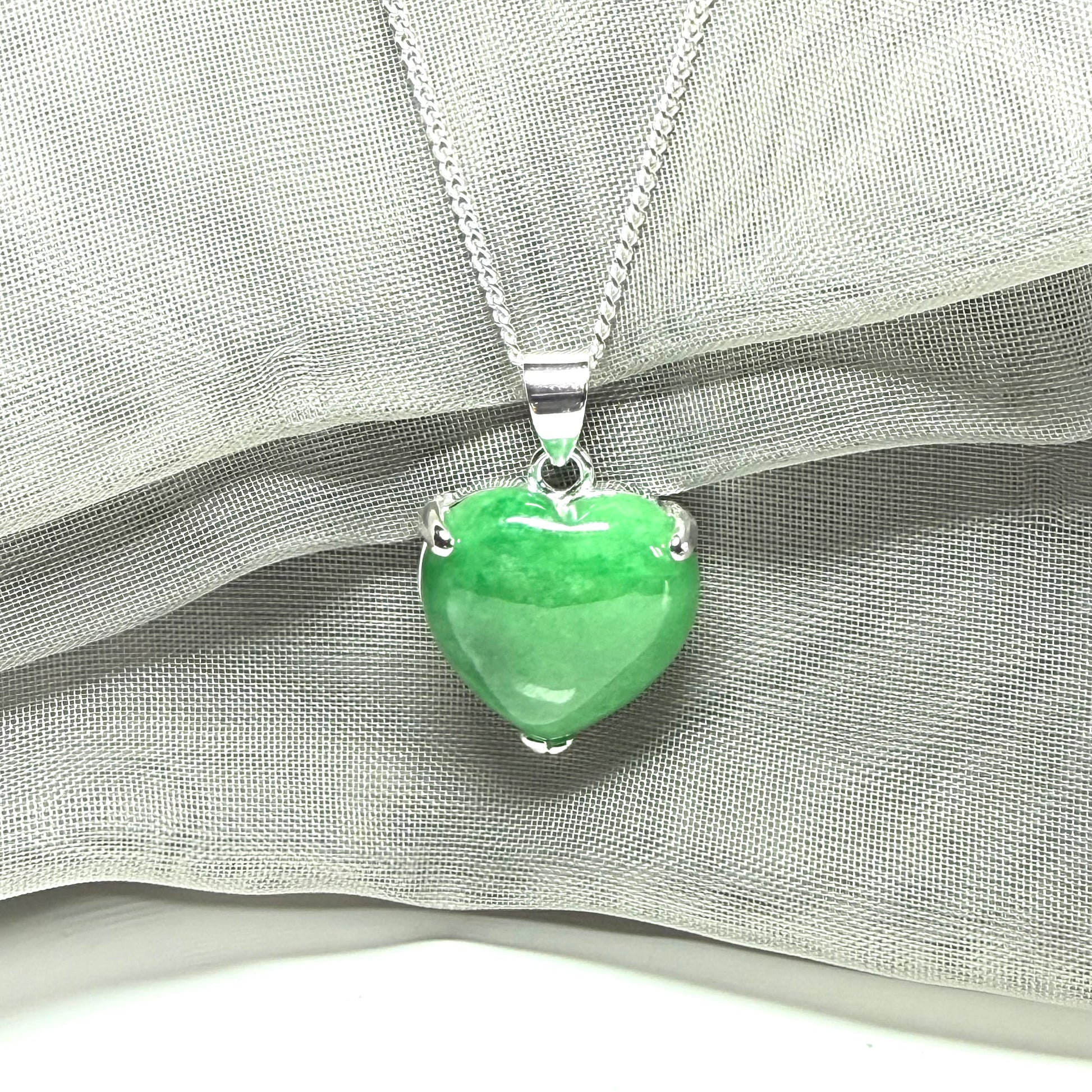 A really beautiful real green jade necklace heart shaped sterling silver, a stunning pendant