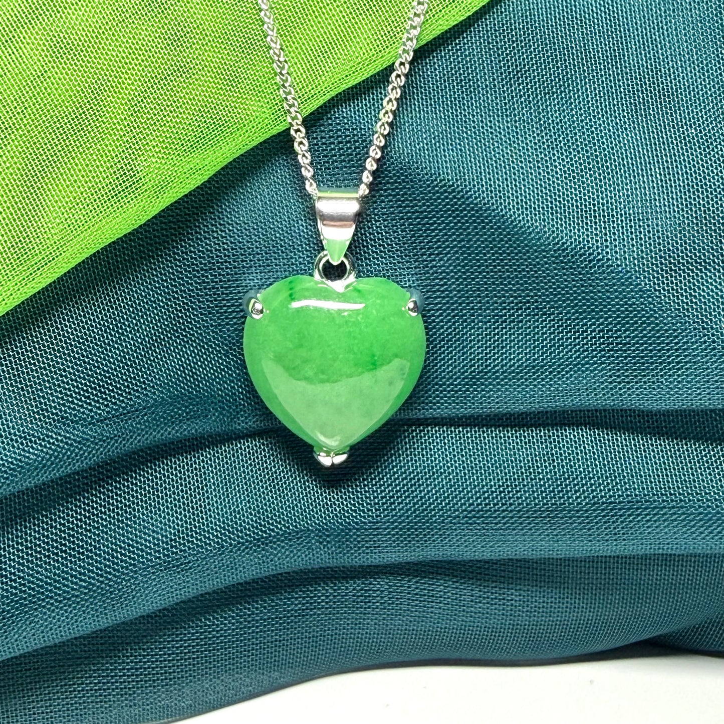 A real green jade necklace heart shape sterling silver, a timeless pendant and chain