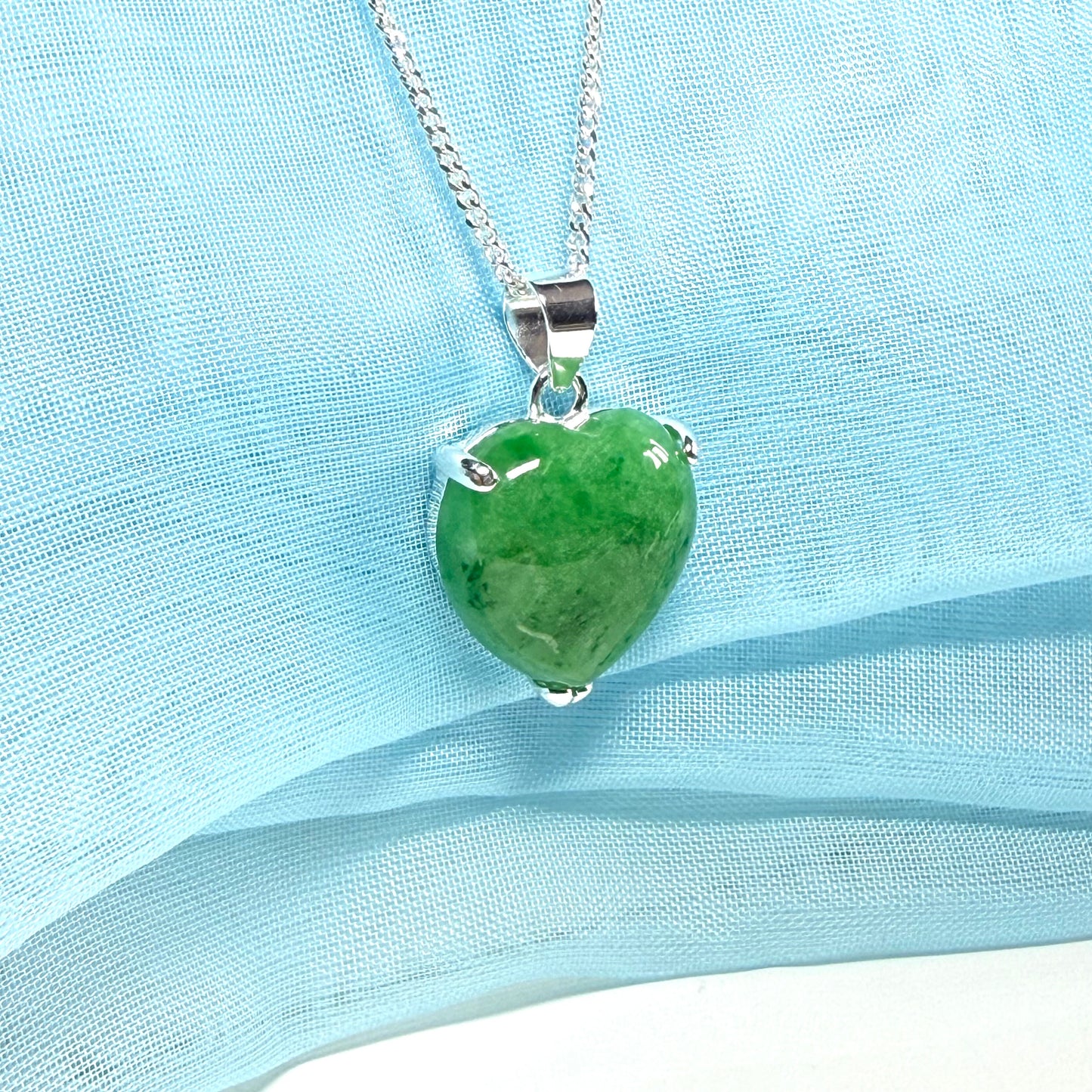 A real green jade necklace heart shape sterling silver with solid chain and box included as well