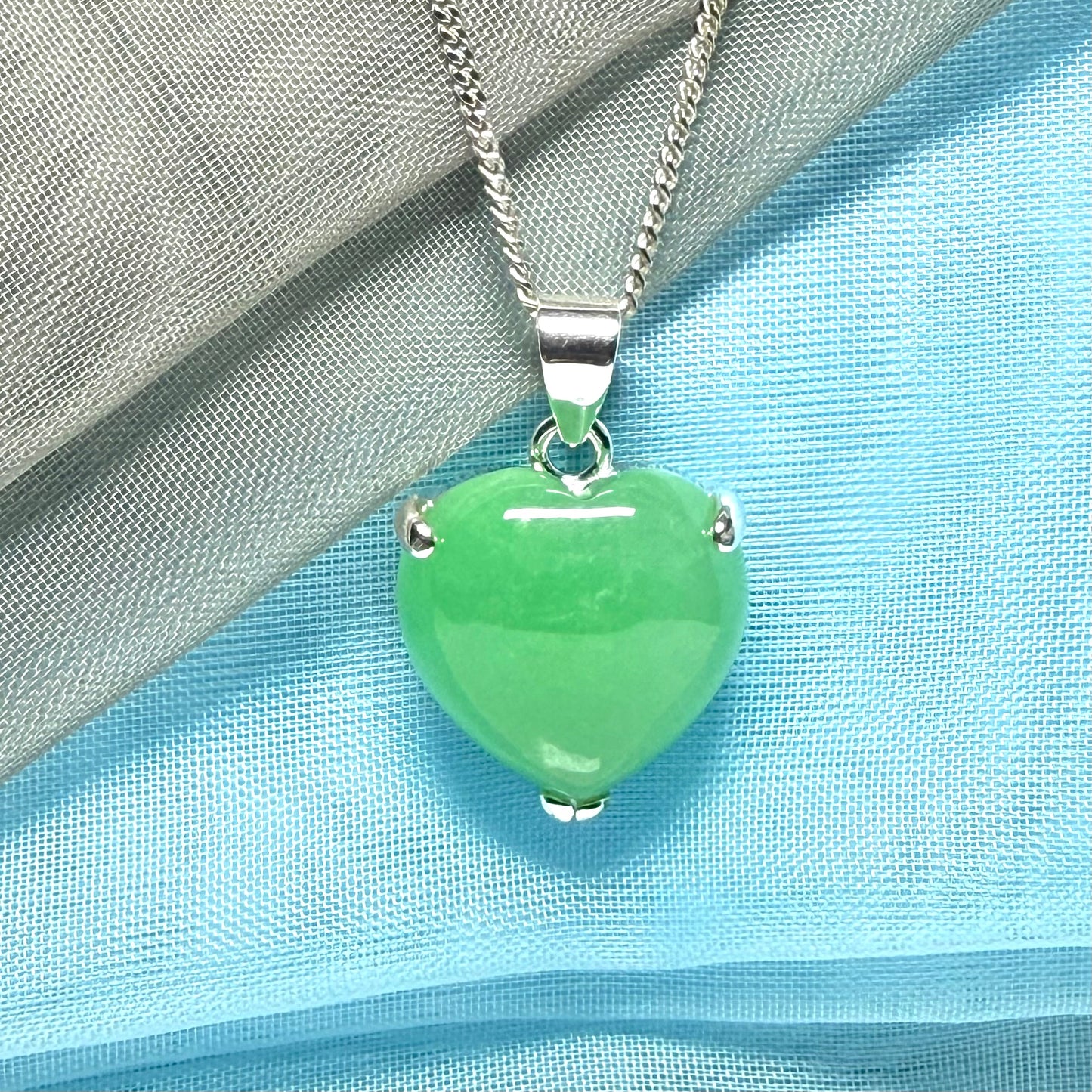 A real green jade necklace heart shaped sterling silver with chain