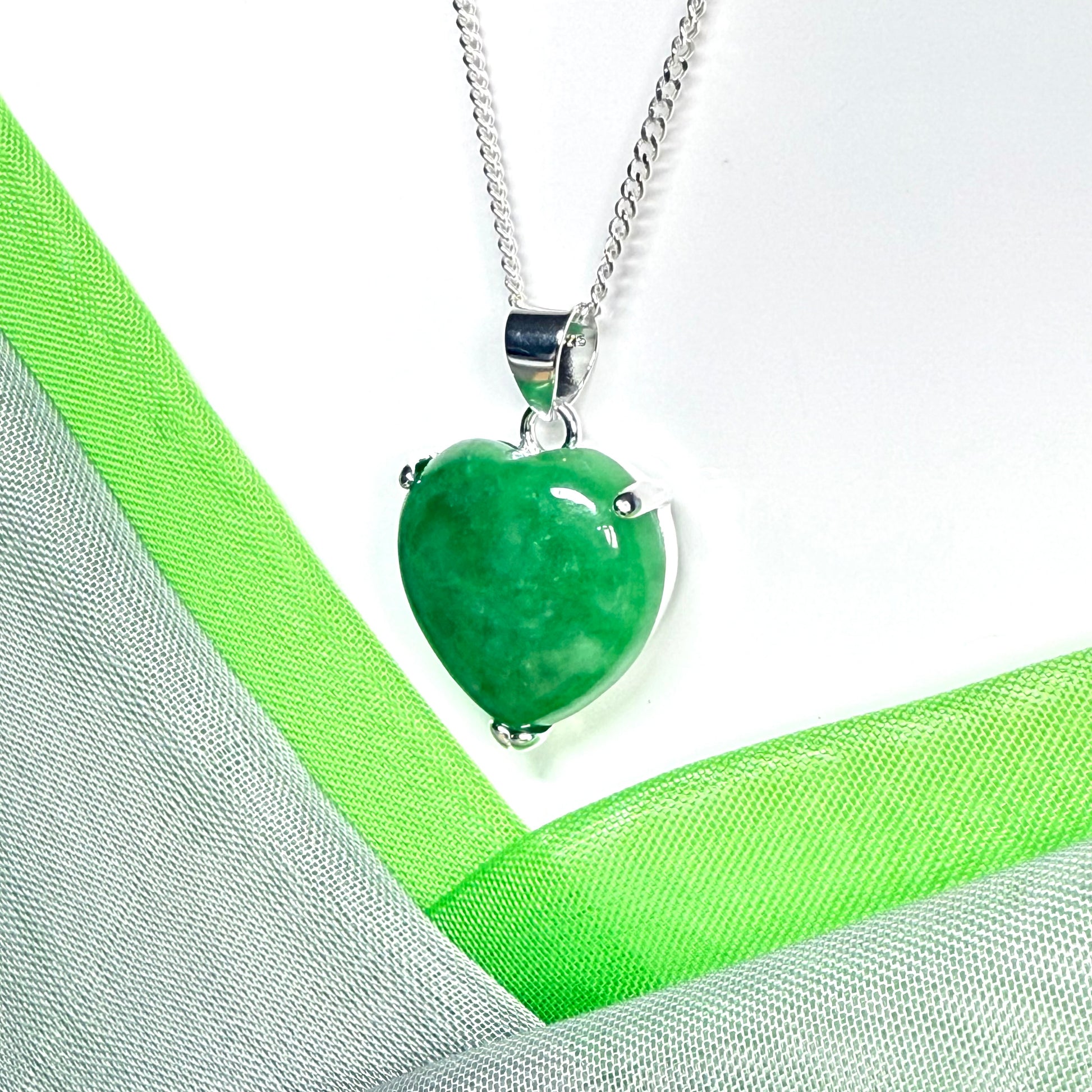A real green jade necklace heart shape sterling silver with solid chain and box included