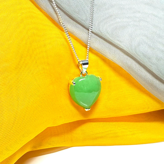 A real green jade necklace heart shaped sterling silver with chain included as well