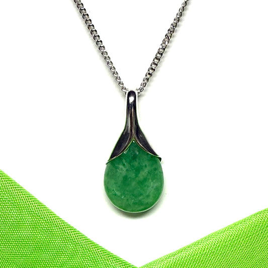 A real green jade necklace in a teardrop or pear shaped including a solid chain