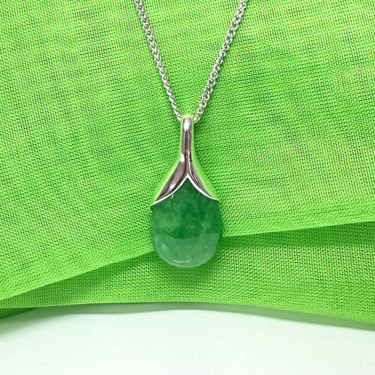 A real green jade necklace in a tear drop or pear shape, a timeless designed pendant