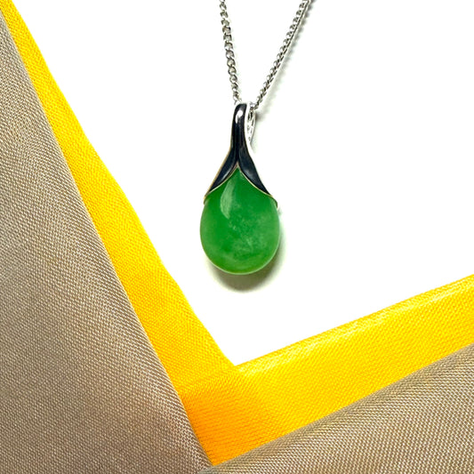 A real green jade necklace in a tear drop or pear shape, an outstanding designed pendant
