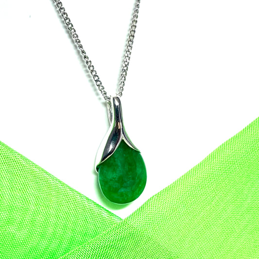 A real green jade necklace in a tear drop or pear shape, a timeless designed pendant