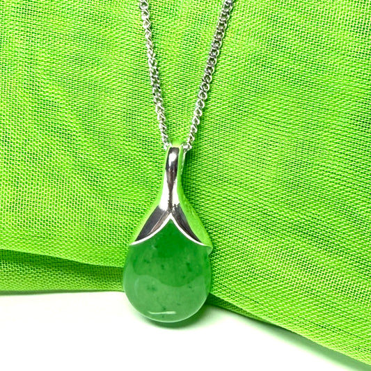 A real green jade necklace in a tear drop or pear shaped with a chain included