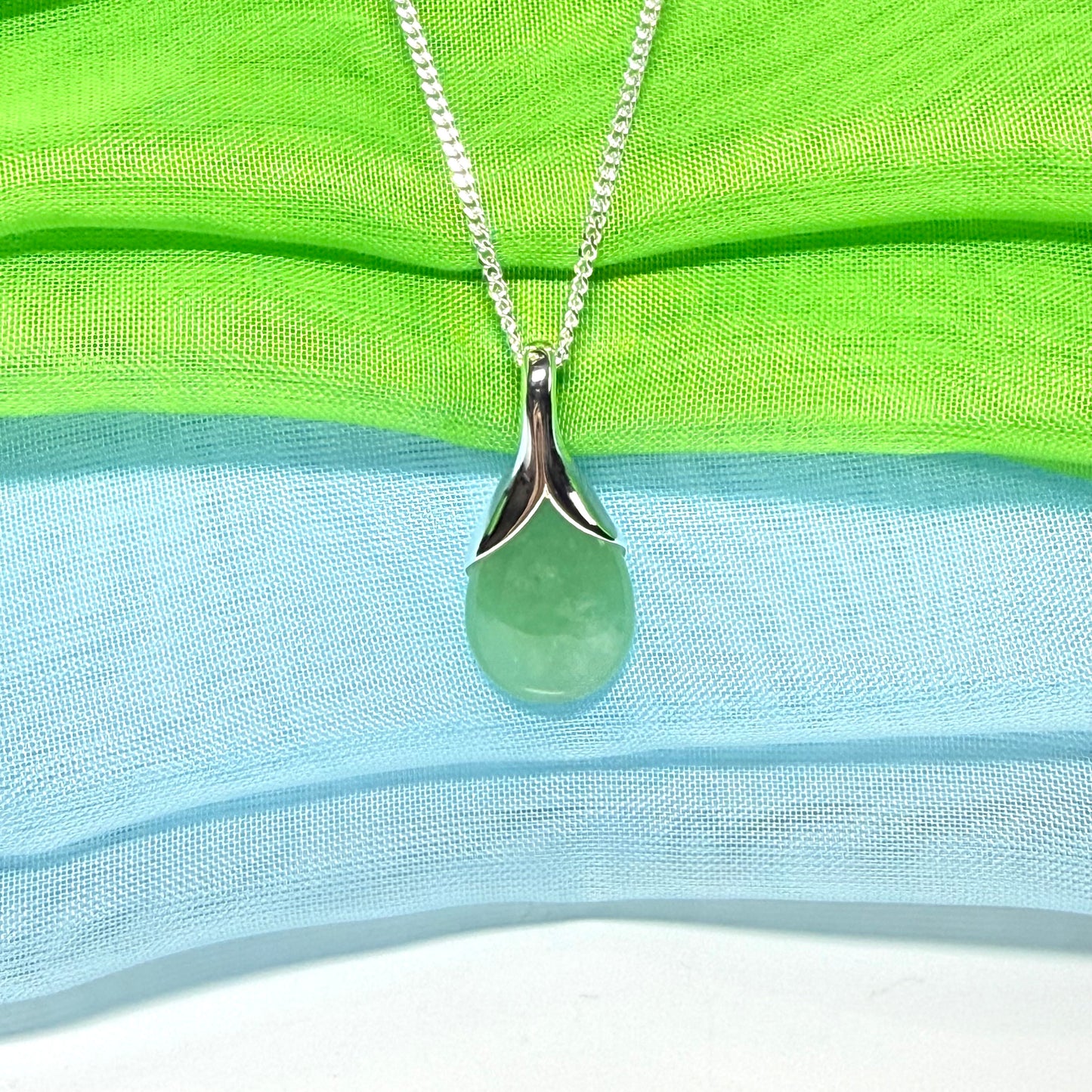 A beautiful real green jade necklace in a teardrop or pear shape, a really stunning designed pendant
