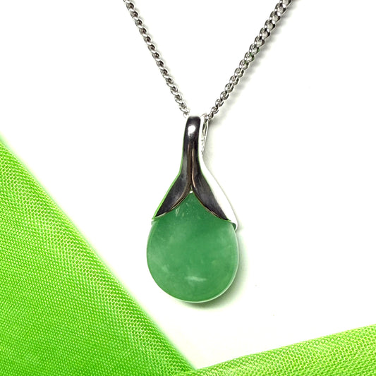A real green jade necklace in a teardrop or pear shaped including a chain and gift box