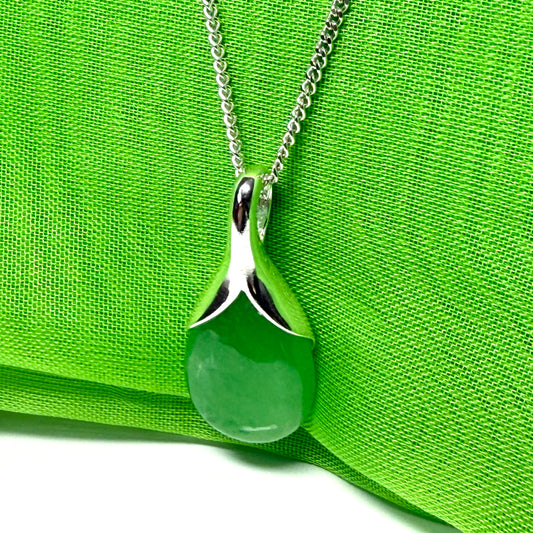 A real green jade necklace in a teardrop or pear shaped pendant