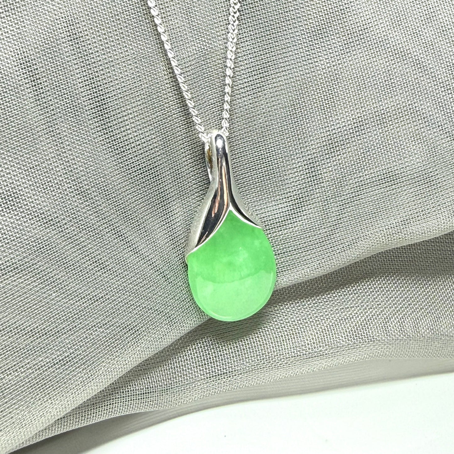 Real green jade necklace in a teardrop or pear shaped, a simply stunning pendant