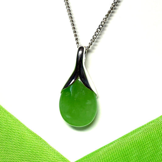 A real green jade necklace in a teardrop shaped or pear shaped