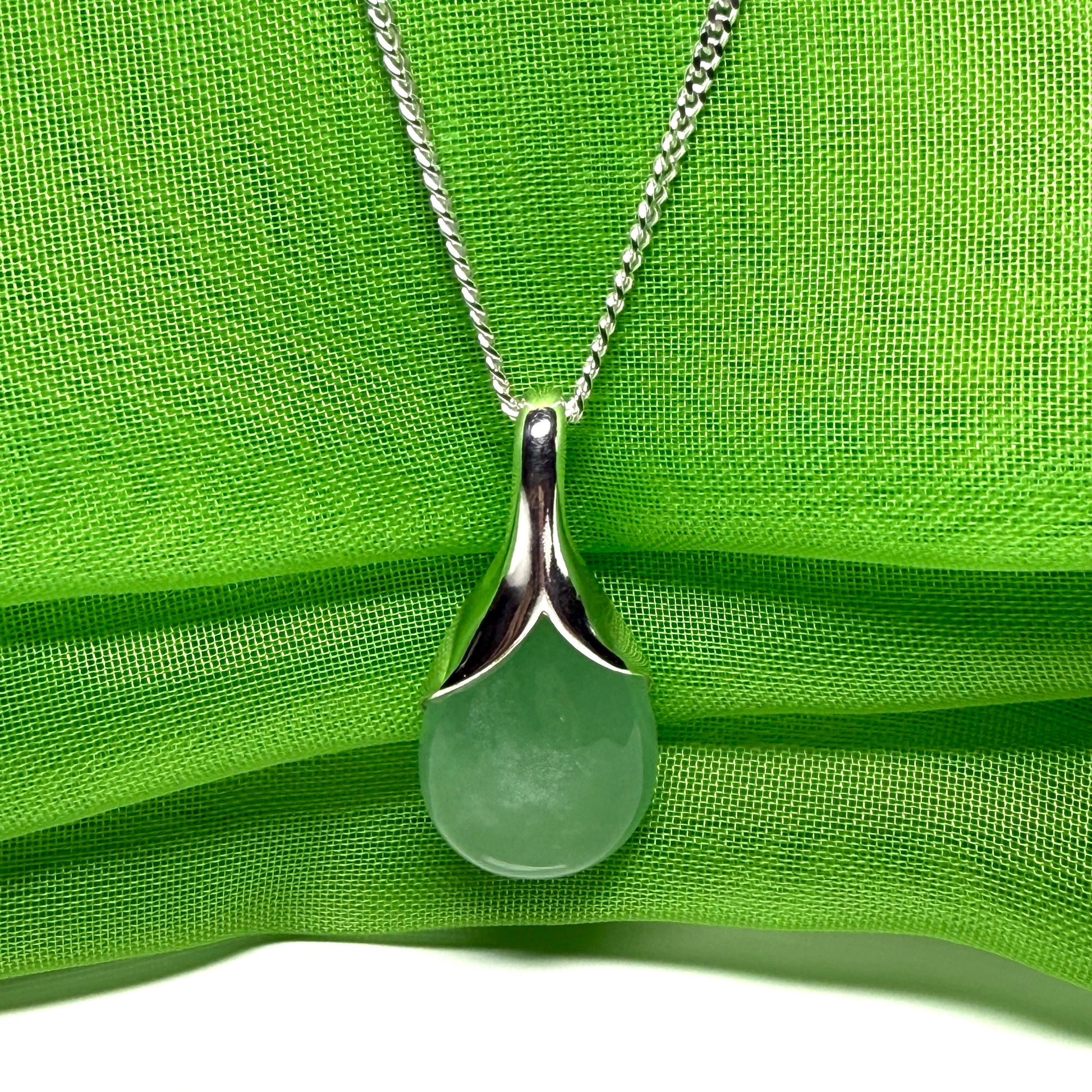 Real green jade necklace in a teardrop with pear shape, a timeless stunning designed pendant