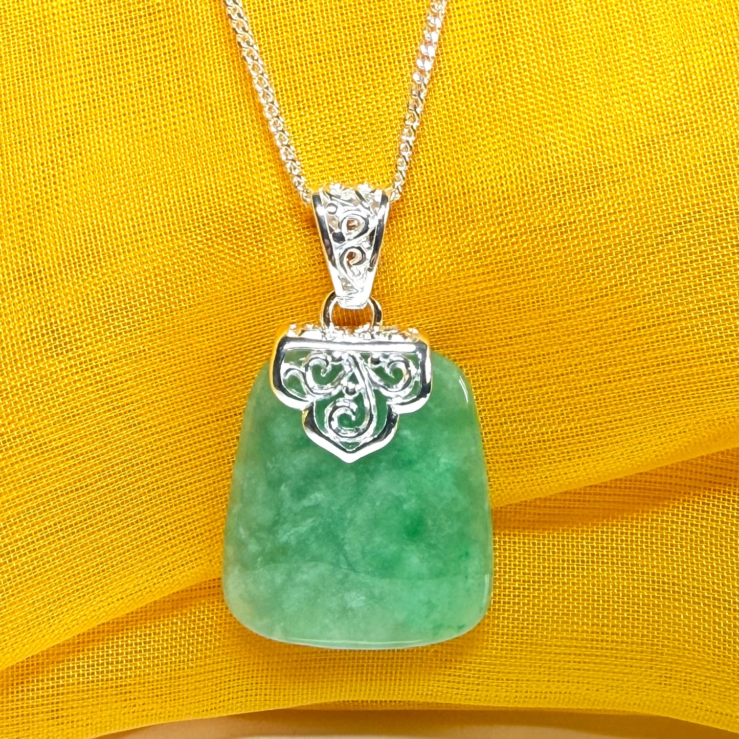 A real green jade necklace sterling silver large cushion shaped including a curb chain, beautiful