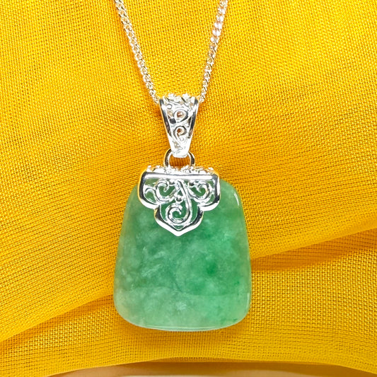 A real green jade necklace sterling silver large cushion shaped including a curb chain, beautiful