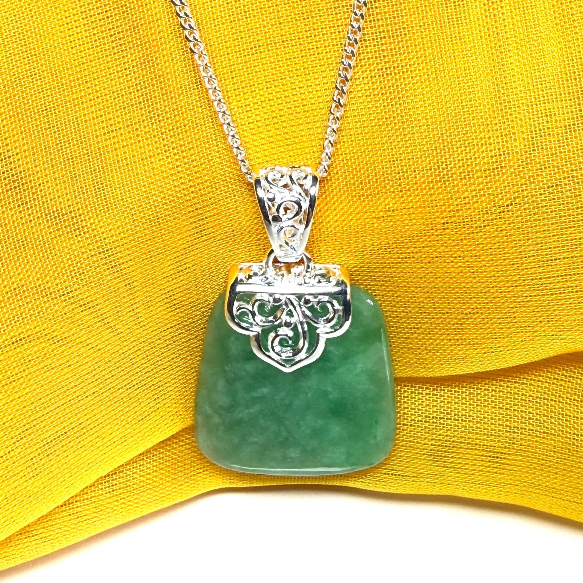 A real green jade necklace sterling silver large cushion shaped including a curb chain, beautiful