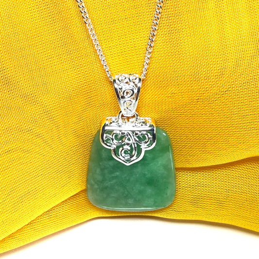 A real green jade necklace sterling silver large cushion shaped including a curb chain, beautiful