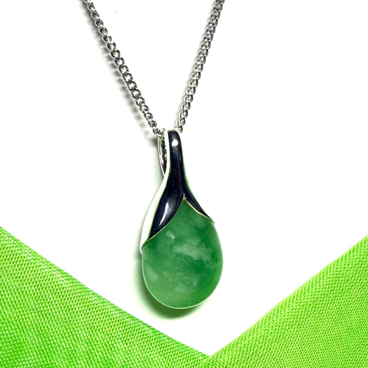 A real green jade necklace teardrop with a pear shaped pendant