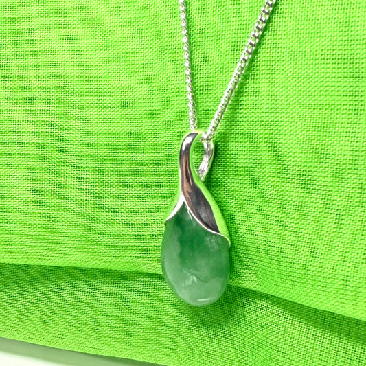 A real green jade necklace teardrop with a pear shaped pendant, with chain included