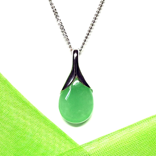 A real green jade necklace teardrop with a pear shaped pendant to it