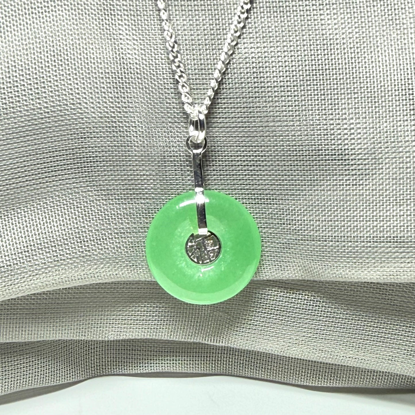 Real green jade necklace with a round pendant sterling silver and a chain