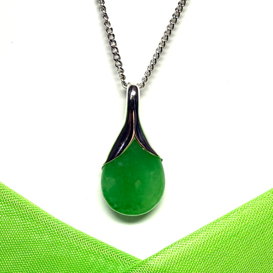 A real green jade necklace in a teardrop or pear shaped pendant