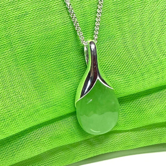 A real green jade necklace in a teardrop shaped or pear shaped