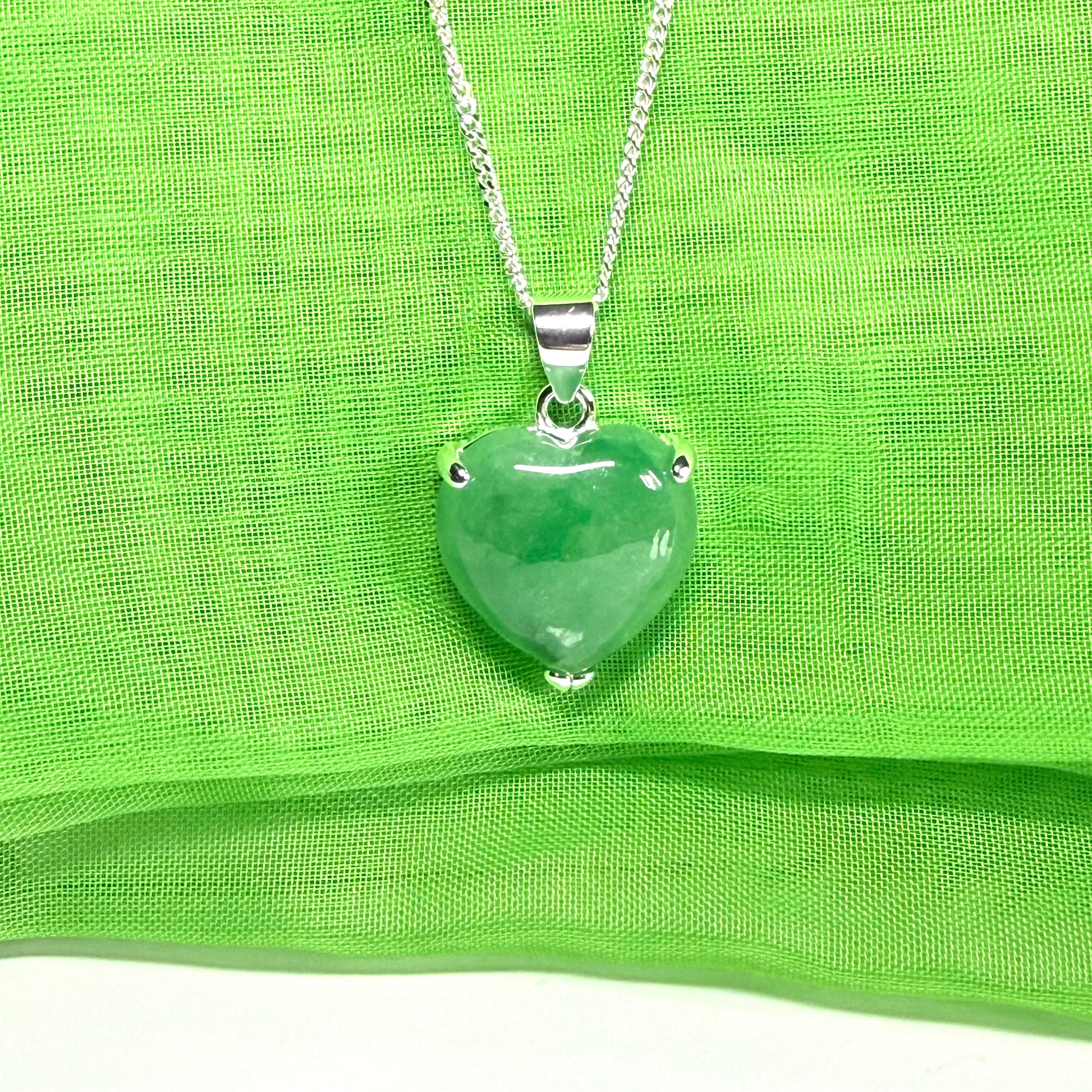 A real green jade pendant heart shaped sterling silver, an eye opening designed necklace