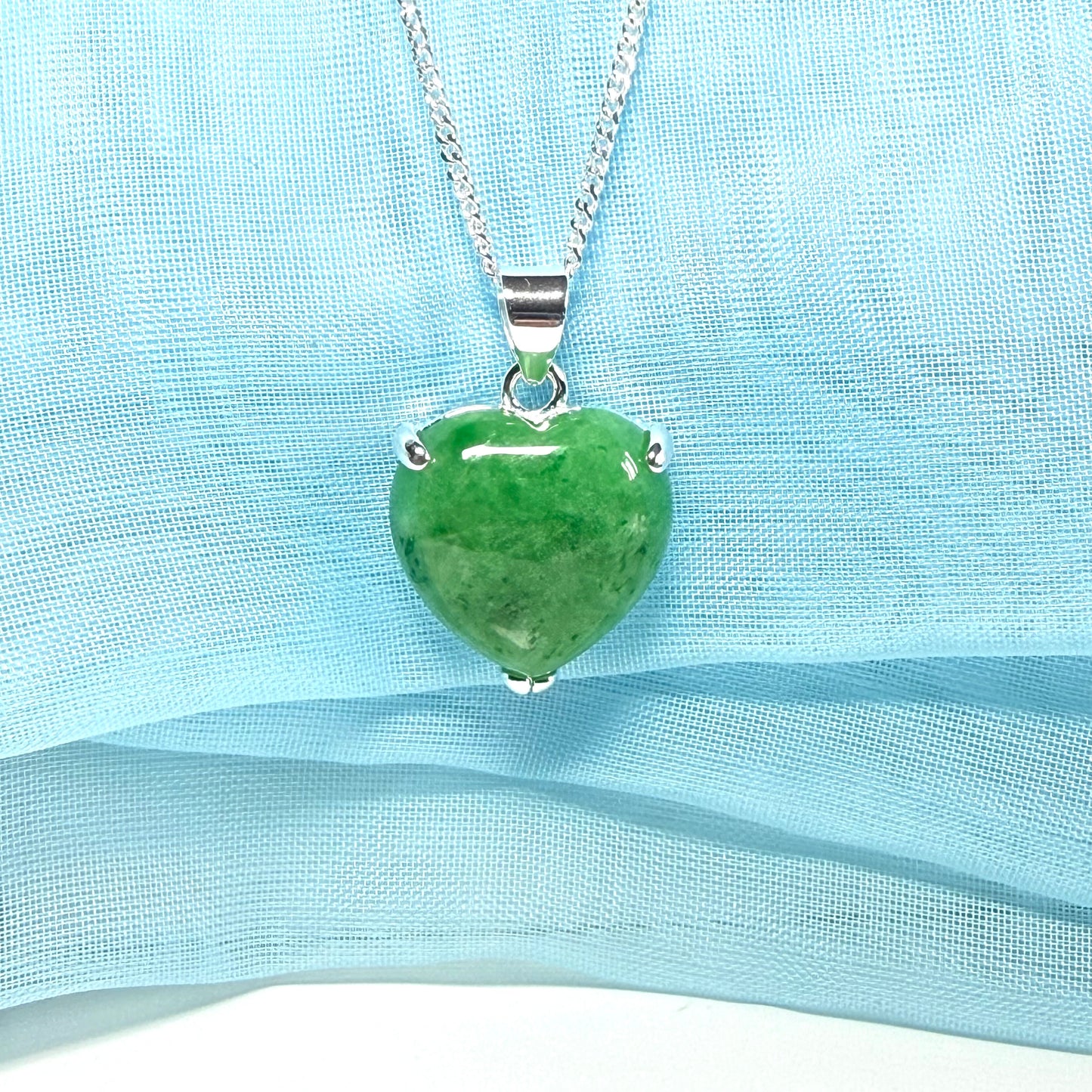 A real green jade necklace heart shape sterling silver with solid chain and box included as well