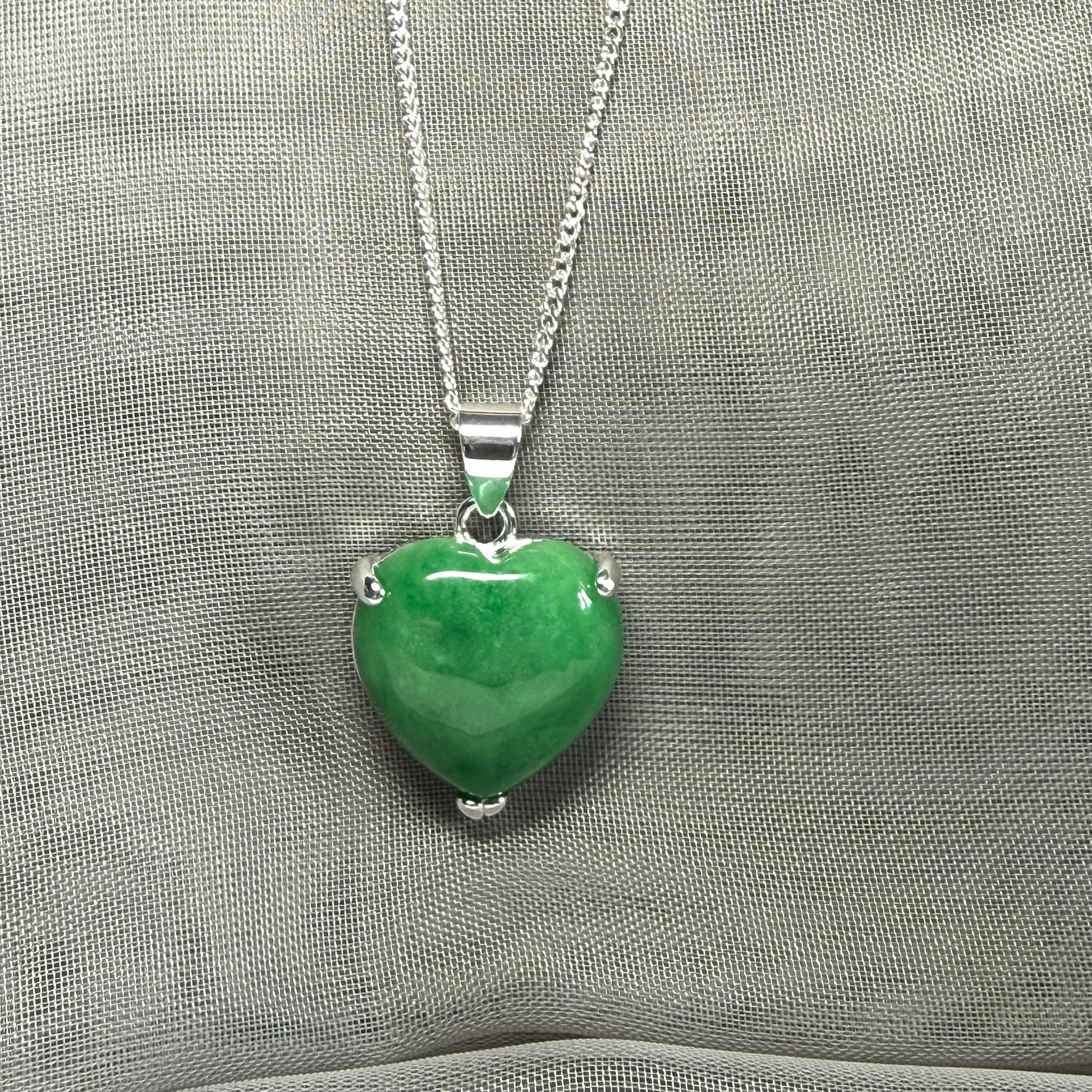 A real green jade pendant heart shaped sterling silver, a traditional designed necklace