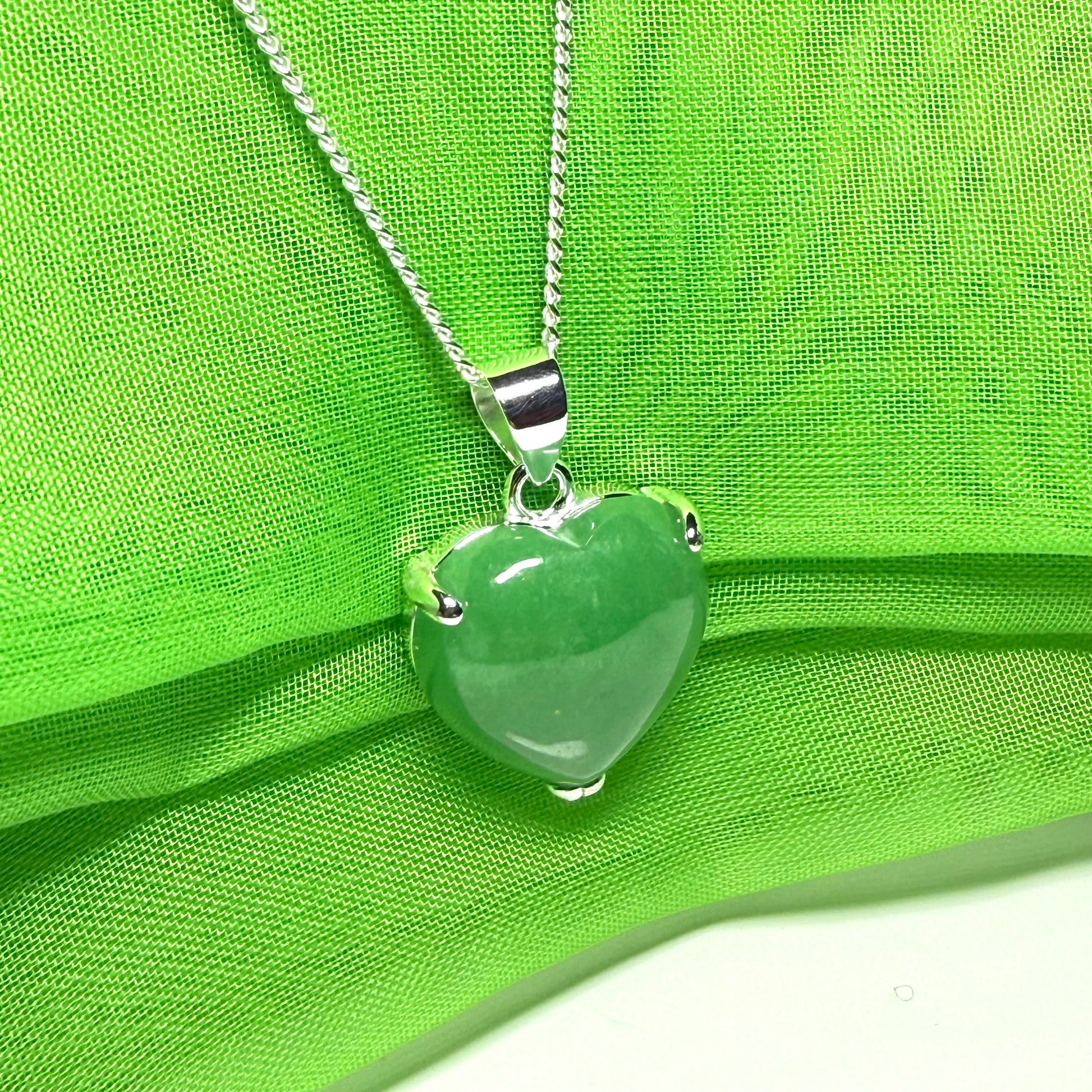 A real green jade pendant heart shaped sterling silver, a traditionally designed necklace