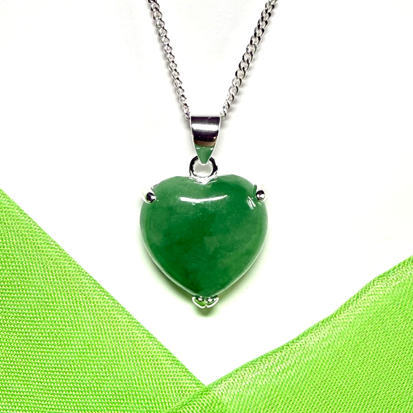 A real green jade pendant heart shaped sterling silver, an eye opening designed necklace