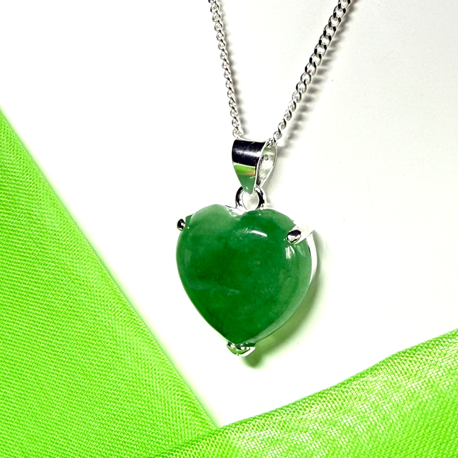 A real green jade pendant heart shaped sterling silver, an eye opening designed necklace with a chain
