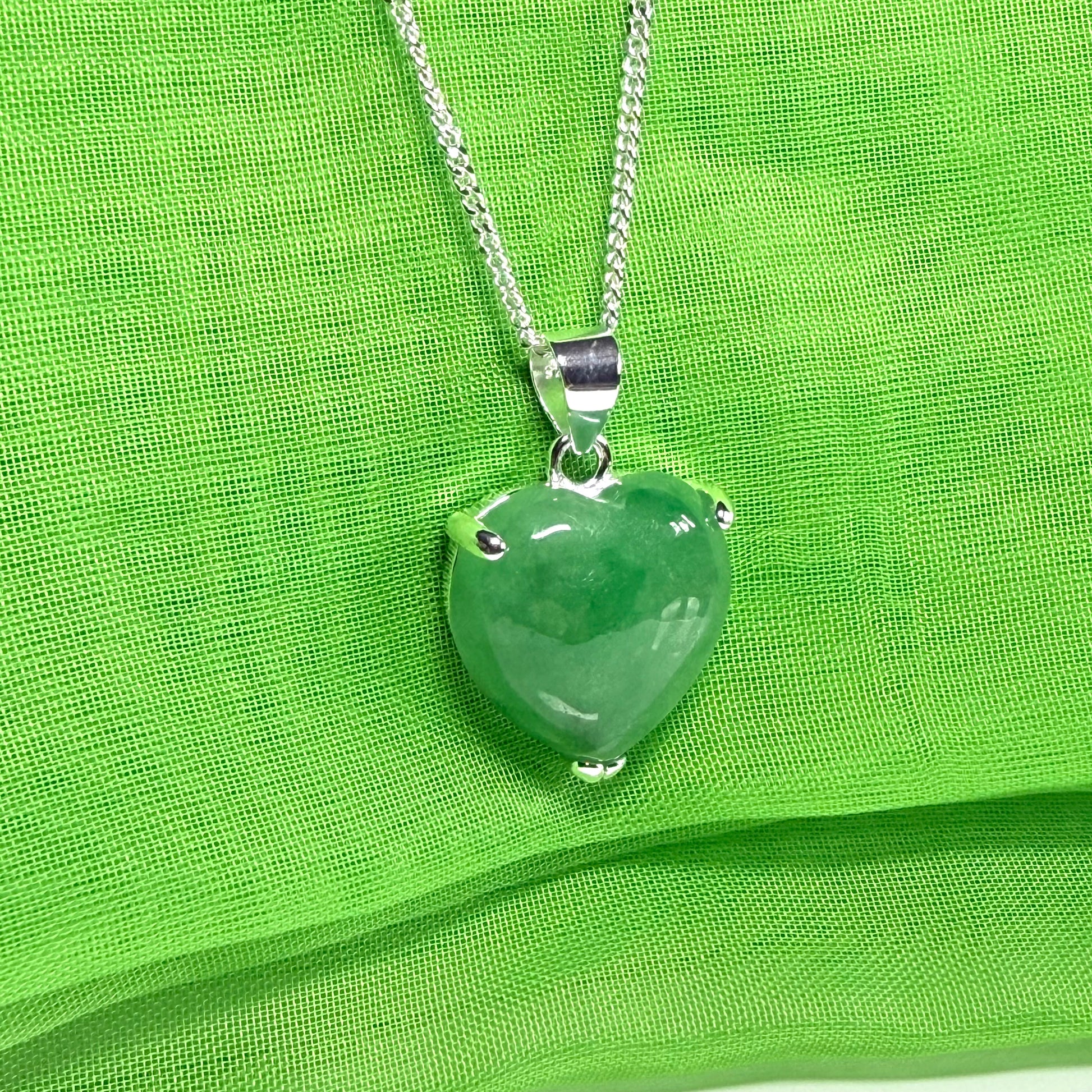 A real green jade pendant heart shaped sterling silver, an eye opening designed necklace