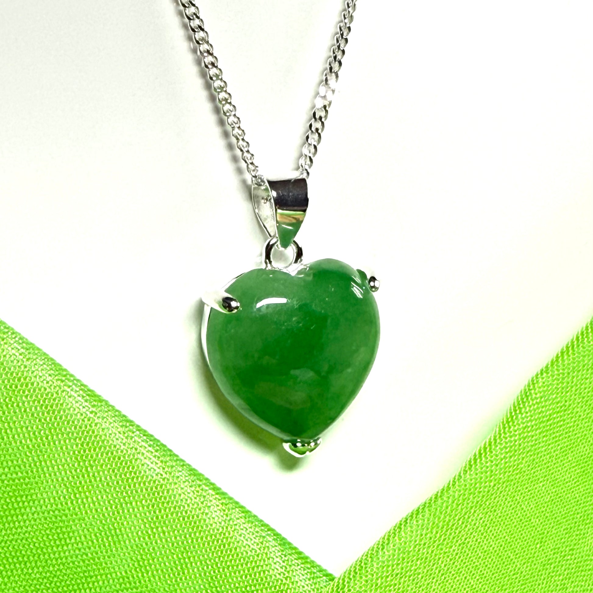 A real green jade pendant heart shaped sterling silver, an eye opening designed necklace