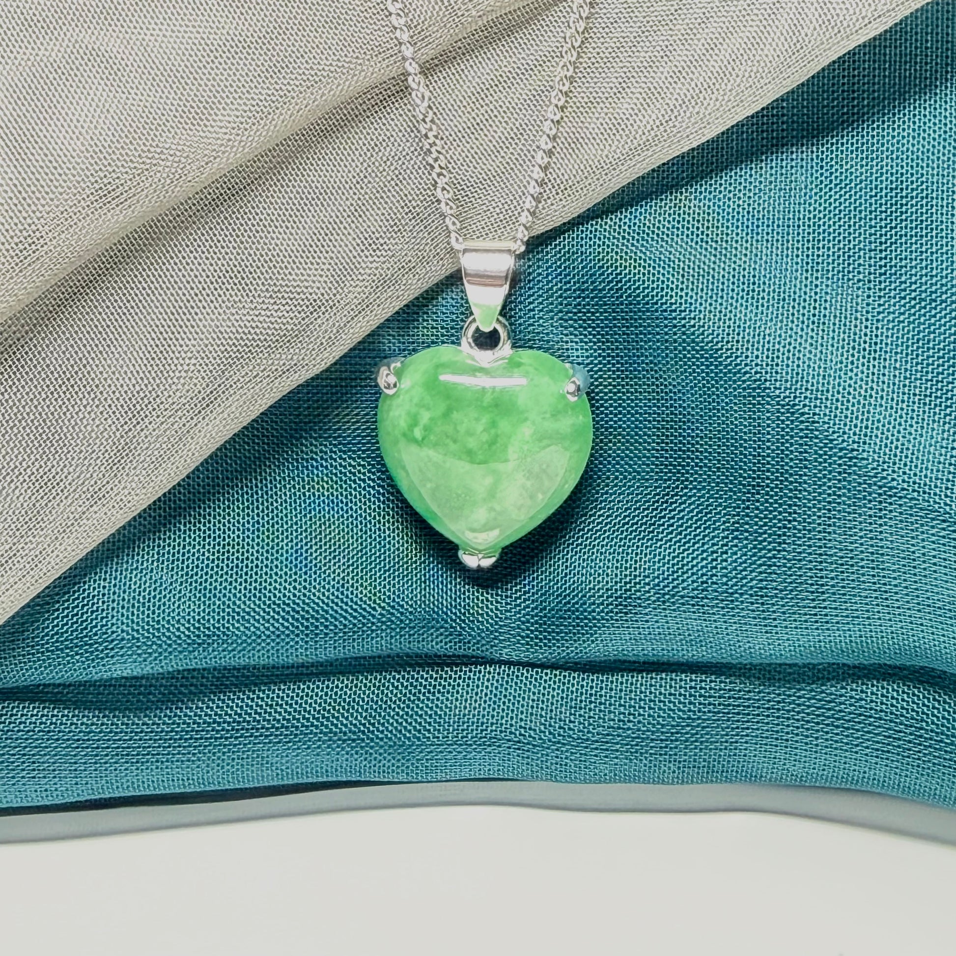 A real green jade pendant necklace heart shape sterling silver and chain