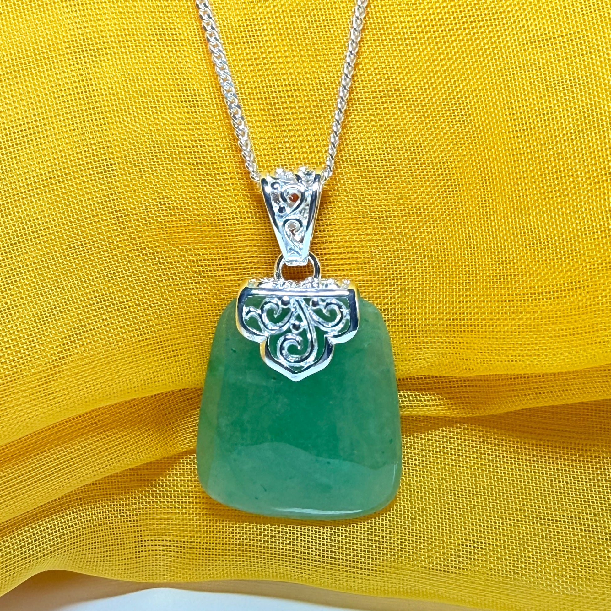 A real jade necklace green sterling silver large cushion shaped, a mesmerising designed pendant