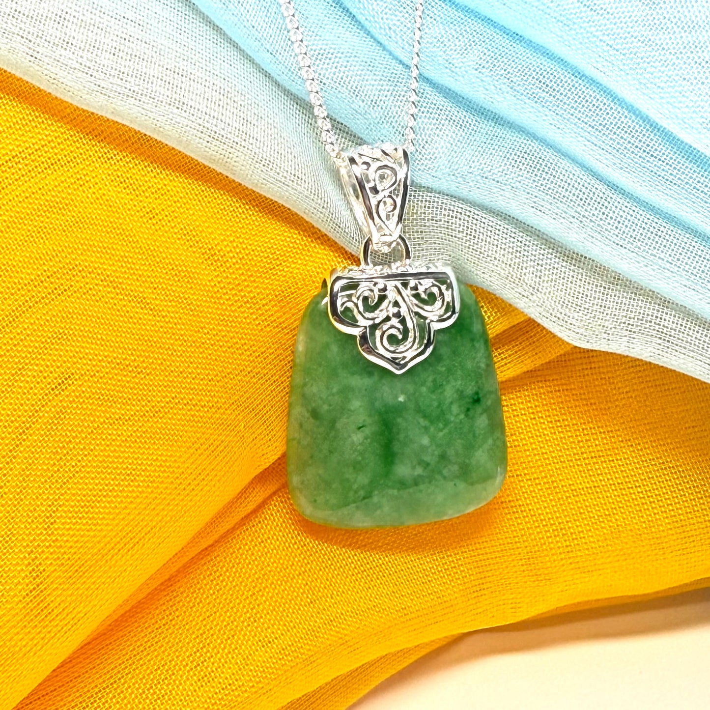 A real jade necklace green sterling silver large cushion shaped, with a beautiful designed pendant with a chain