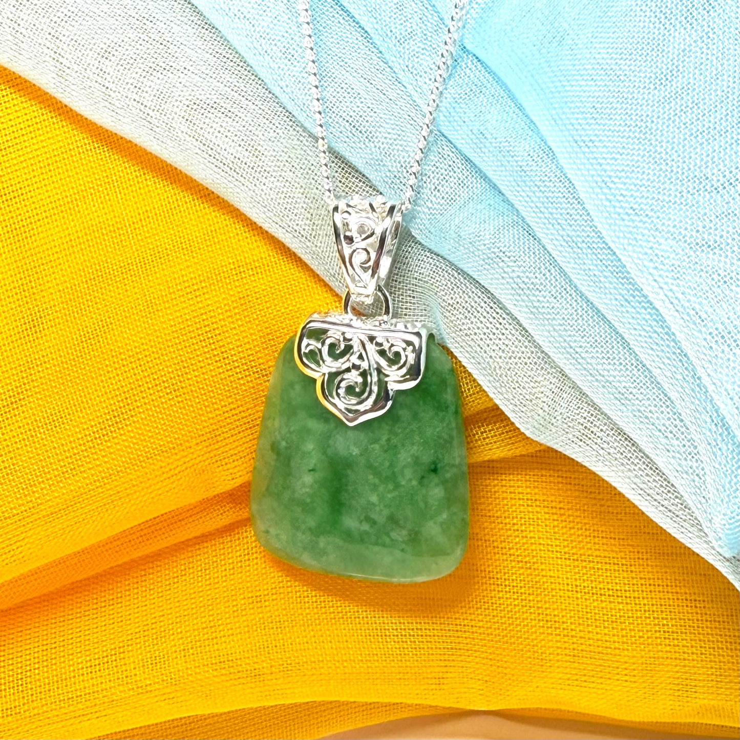 A real jade necklace green sterling silver large cushion shaped, with a beautiful designed pendant with a chain