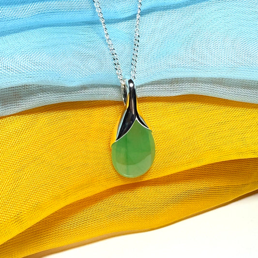 A real jade teardrop shaped designed green necklace or pear shape pendant