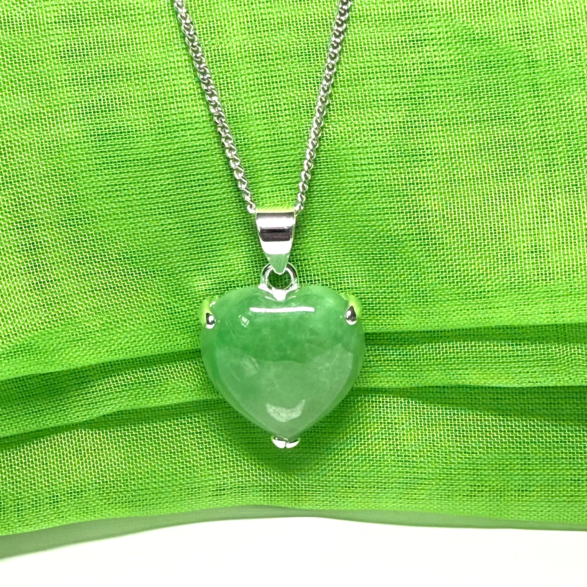 A real light green jade necklace heart shape sterling silver pendant